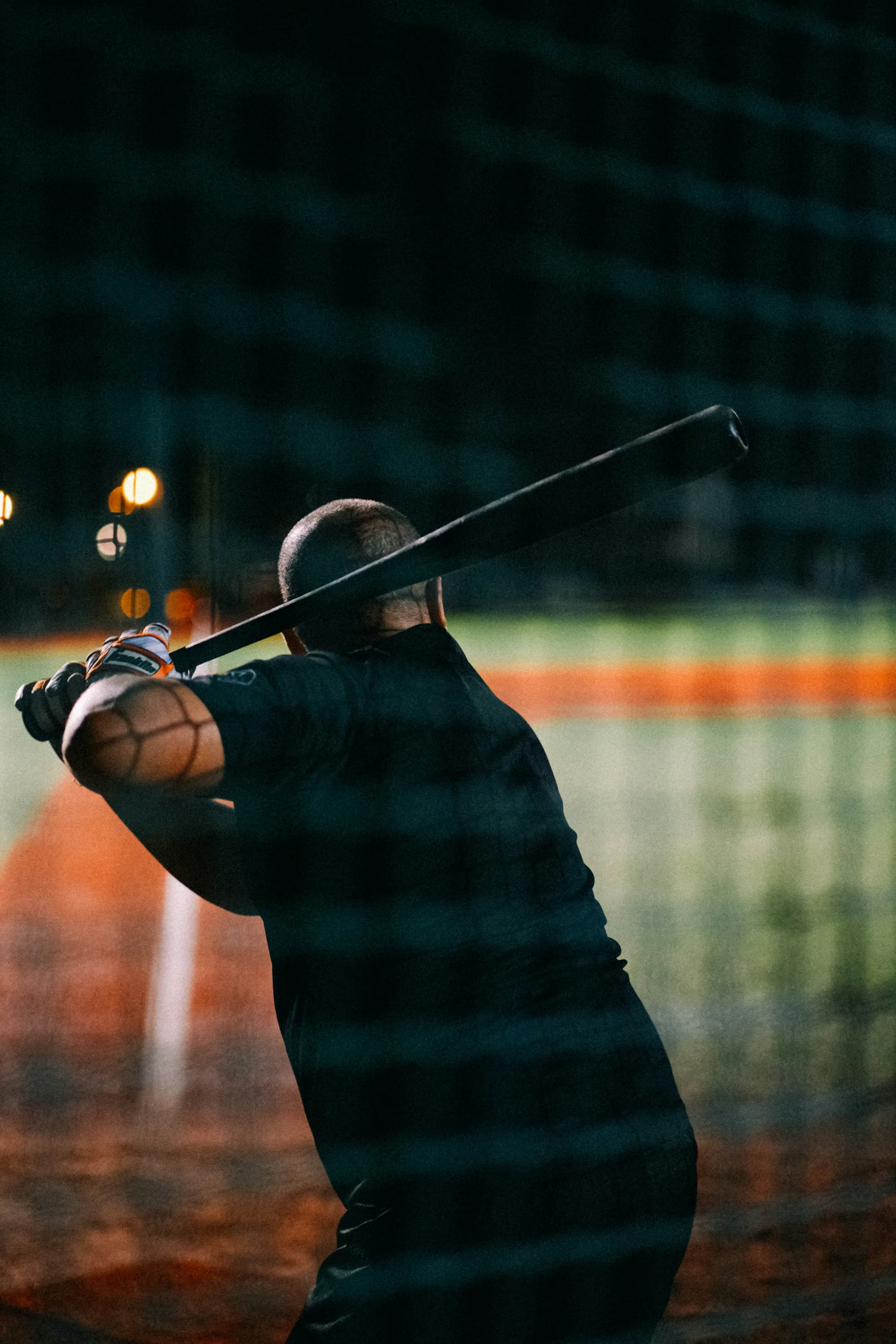 A batter mid-swing at practice