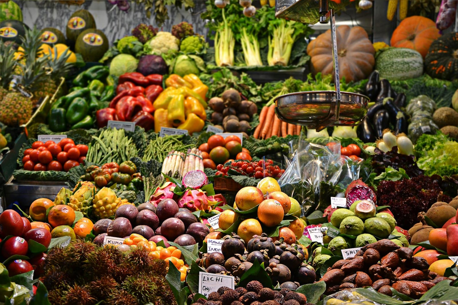 A market stall piled high with fruit and vegetables